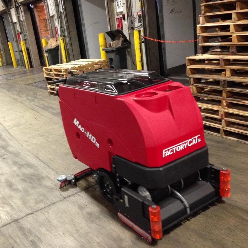 FactoryCat Walk Behind Floor Scrubbers Mag-HD aisles concrete - https://assets.factorycat.com/demoImages/2025/april/Mag-HD-Walk Behind Floor Scrubbers-aisles-concrete-Dallas -USA-803.jpg - 800 - 800 - 803 A FactoryCat Mag-HD Walk Behind Floor Scrubber is cleaning the concrete aisles of a Dallas, Texas warehouse club