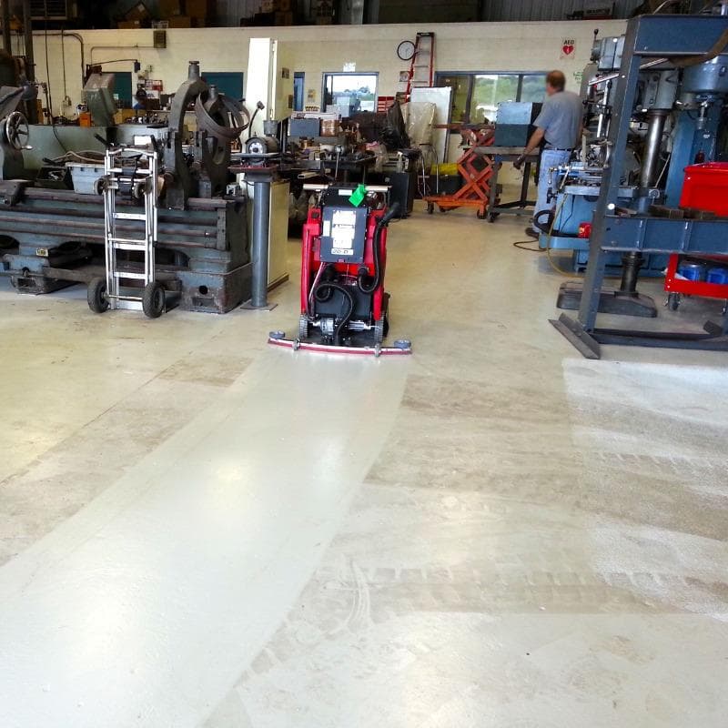 FactoryCat Walk Behind Floor Scrubbers MicroMag maintenance shop epoxy - https://assets.factorycat.com/demoImages/2025/april/MicroMag-Walk Behind Floor Scrubbers-maintenance shop-epoxy-Melbourne-USA-578.jpg - 800 - 800 - 578 MicroMag Walk Behind Floor Scrubbers cleaning the epoxy floor in an aviation maintenance shop in Melbourne, Florida
